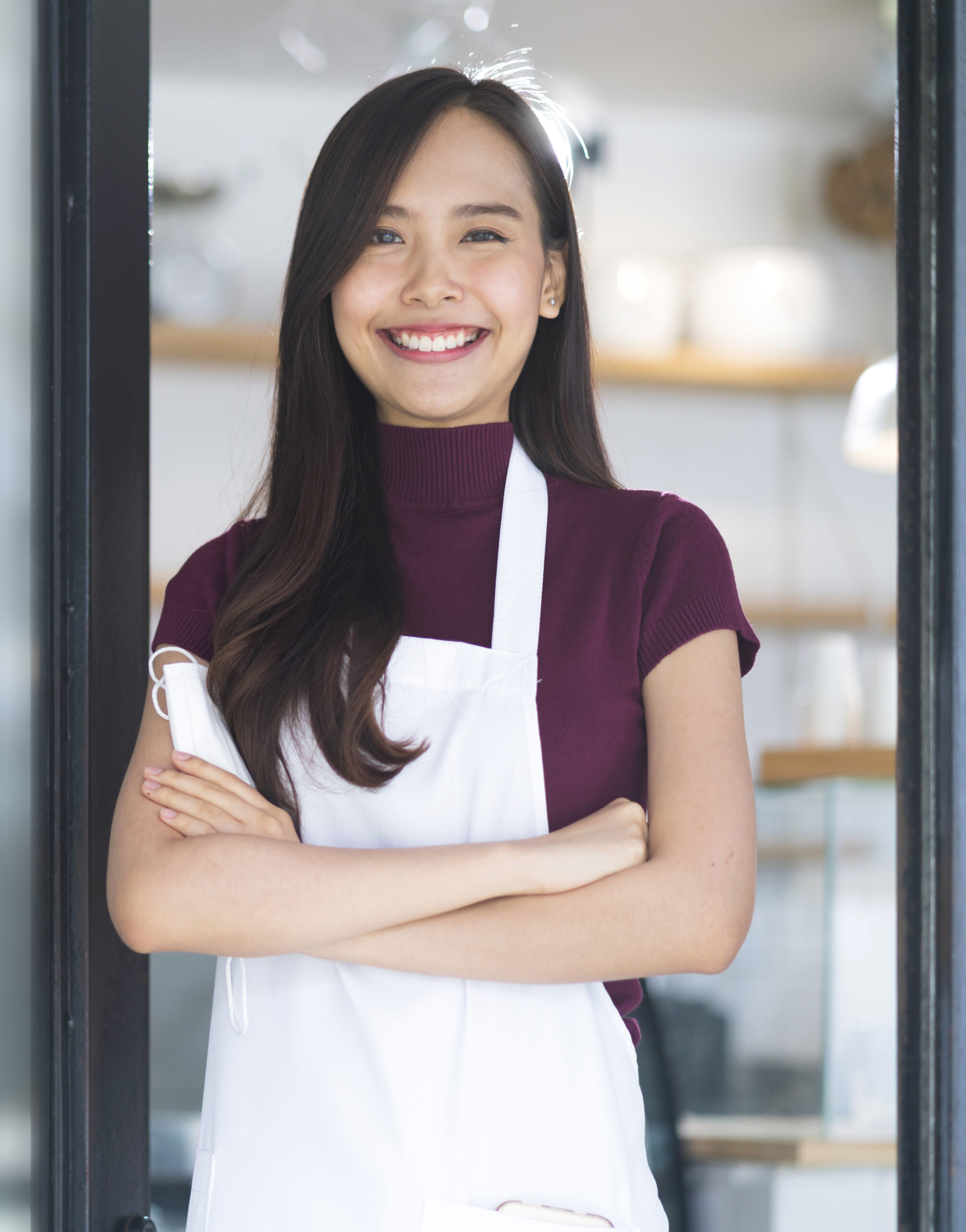 asian attractive female cafe staff wear uniform apron smiling cheerful welcome to cafe reataurant with confident and happiness with positive service mind after lockdown is over in shopfront entrance asian attractive female cafe staff wear uniform apron smiling cheerful welcome to cafe reataurant with confident and happiness with positive service mind after lockdown is over in shopfront entrance