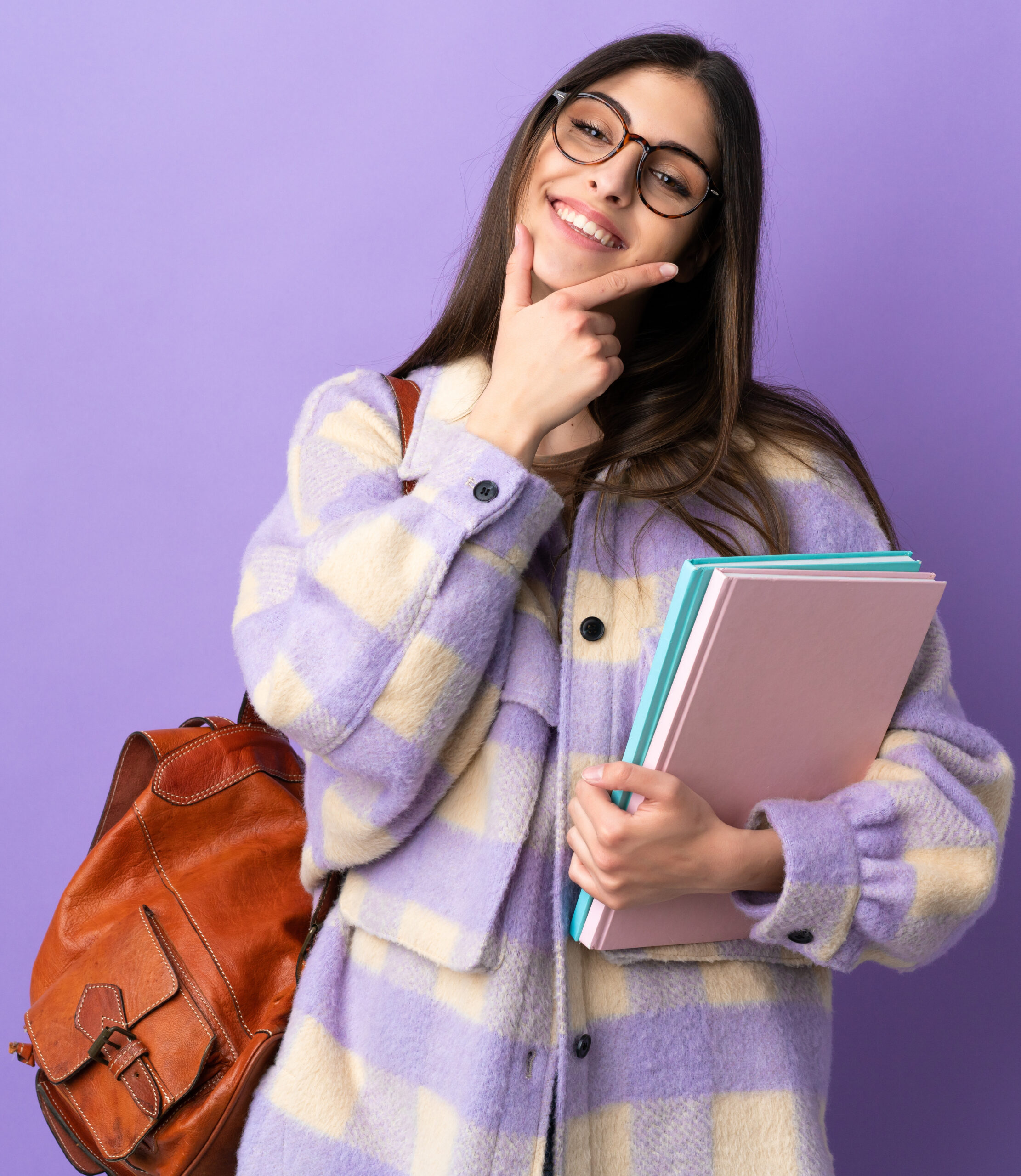 Young student woman isolated on purple background happy and smiling Young student woman isolated on purple background happy and smiling